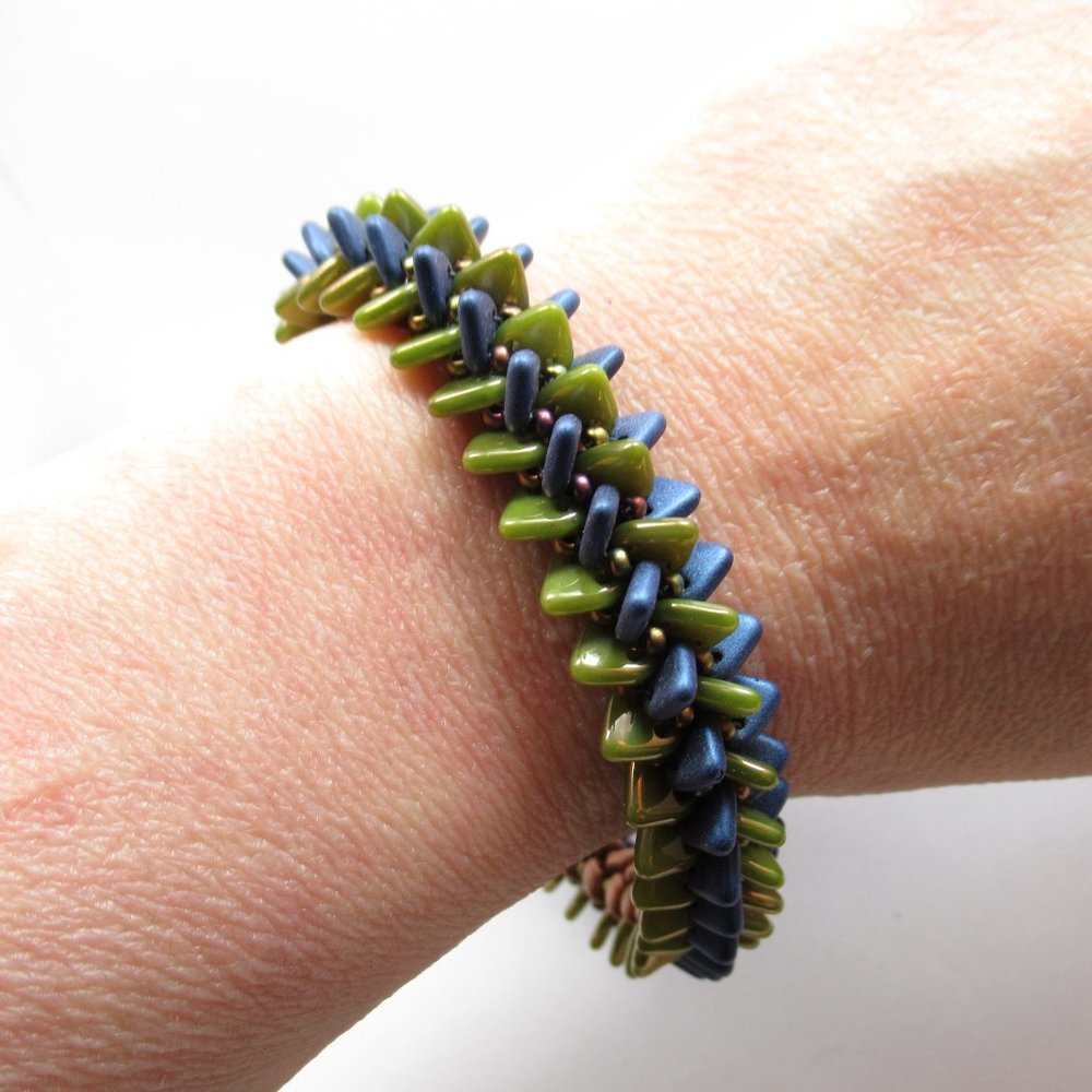 Handwoven blue green and copper bracelet